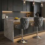 Modern kitchen with gray bar stools and marble island