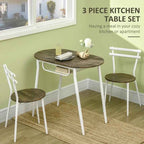3-piece kitchen table set with wooden table and chairs against a green wall.