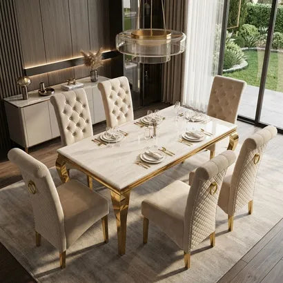 A luxury dining set featuring a rectangular marble-top table with gold legs and six matching tufted upholstered chairs, shown in a modern dining room setting.
