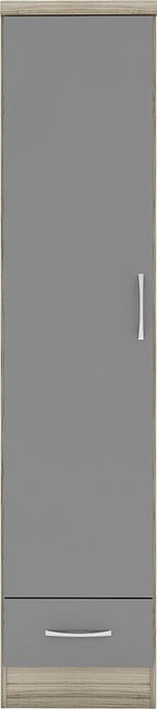 A tall, narrow gray cabinet door with a lower drawer, featuring a vertical silver handle on the door and a horizontal silver handle on the drawer, set against a light wood grain frame.