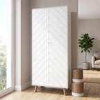 A tall white two-door wardrobe with a geometric chevron pattern on the doors and light wood legs, shown in a modern living room setting.