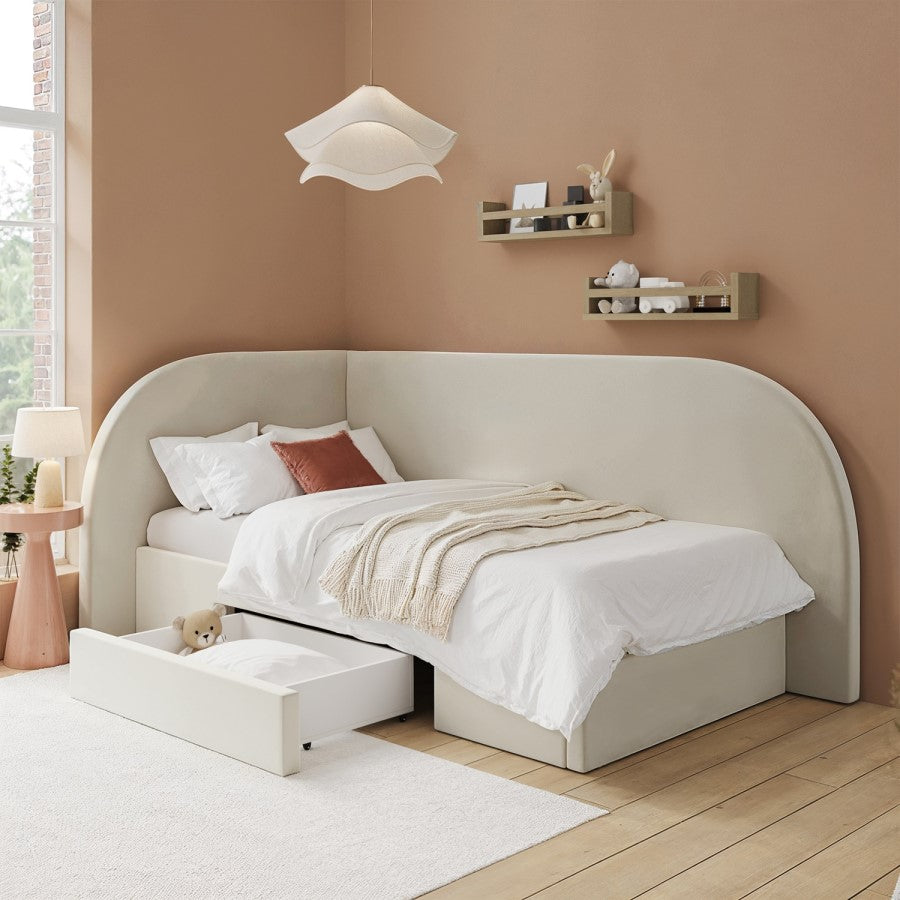Beige upholstered bed with storage drawers in a bedroom setting.