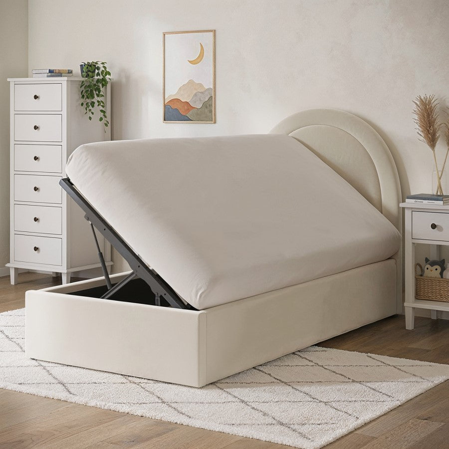 Beige upholstered bed with storage compartment in a bedroom setting.