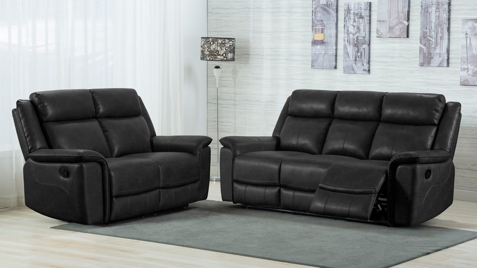 Black leather recliner sofa set in a room with light-colored walls and a rug.