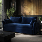 Blue sofabed in a modern living room with a gold abstract painting on the wall.
