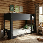 Children's bedroom with a black bunk bed, wooden walls, and decorative elements.