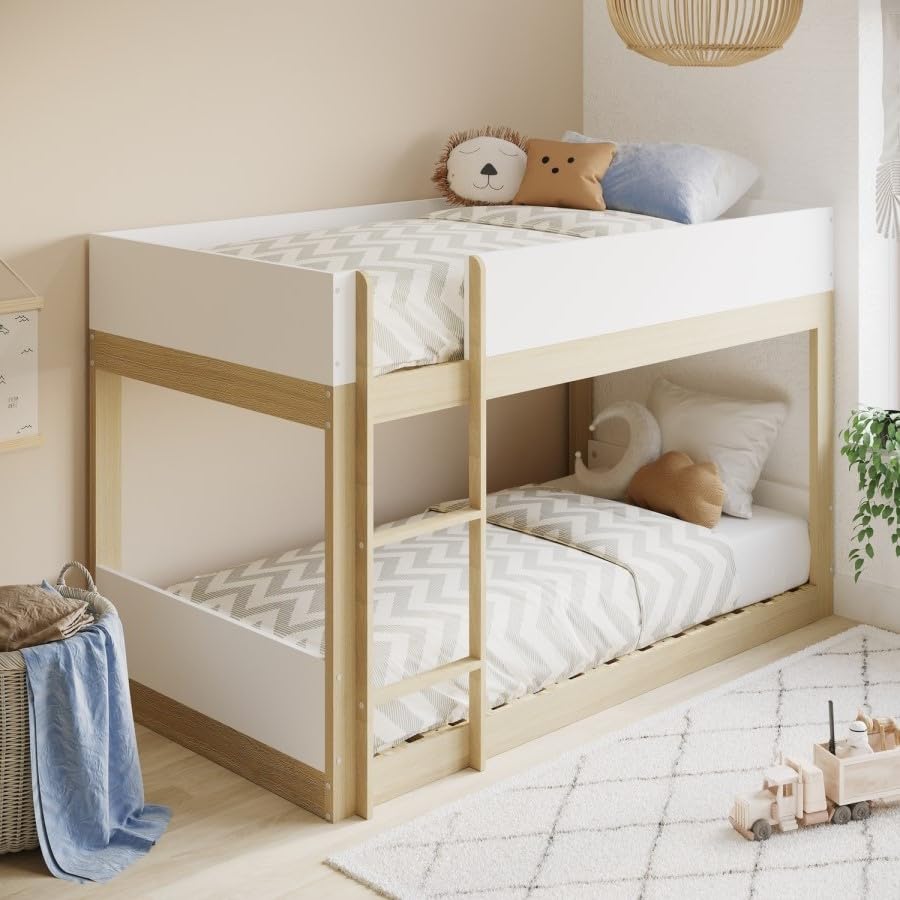 Children's room with a wooden bunk bed, toys, and decorative pillows.