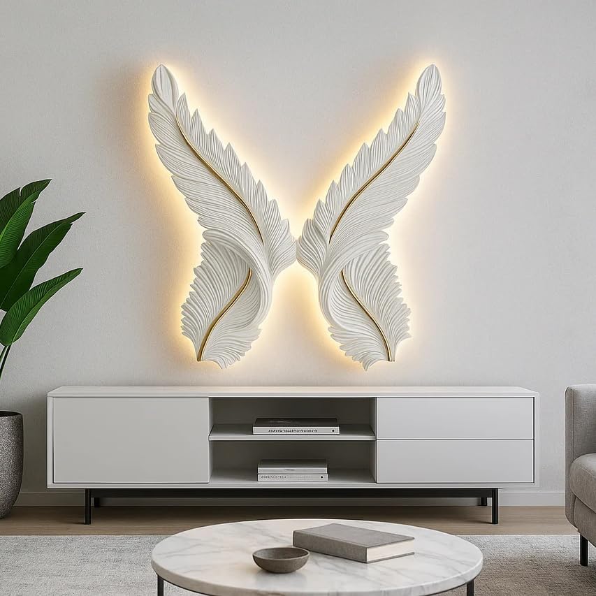 Decorative wall art with feather design illuminated by lights in a modern living room.
