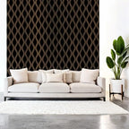 Modern living room with a white sofa, decorative wall, and plant.