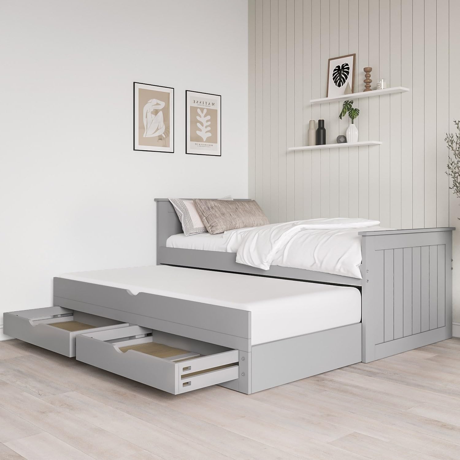 Gray bed with storage drawers in a bedroom setting
