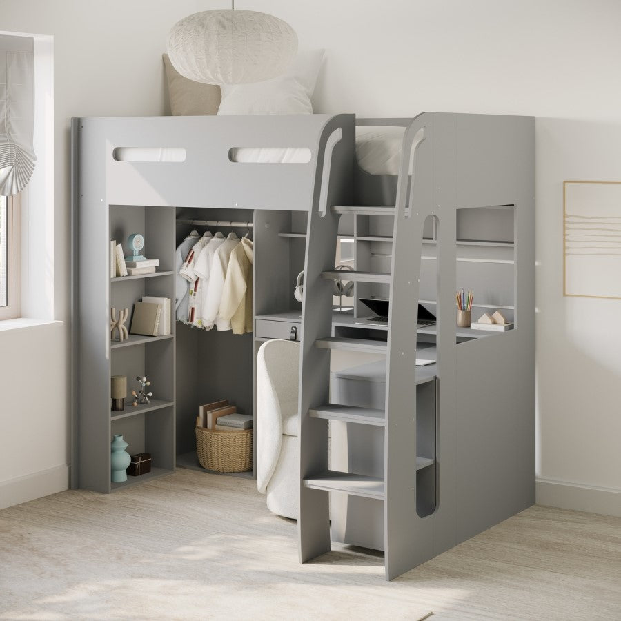 Gray loft bed with stairs in a room with clothes and shelves.