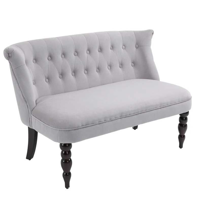 Gray tufted loveseat with dark wooden legs on a white background