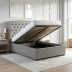 Gray upholstered bed with open storage compartment in a bedroom setting.