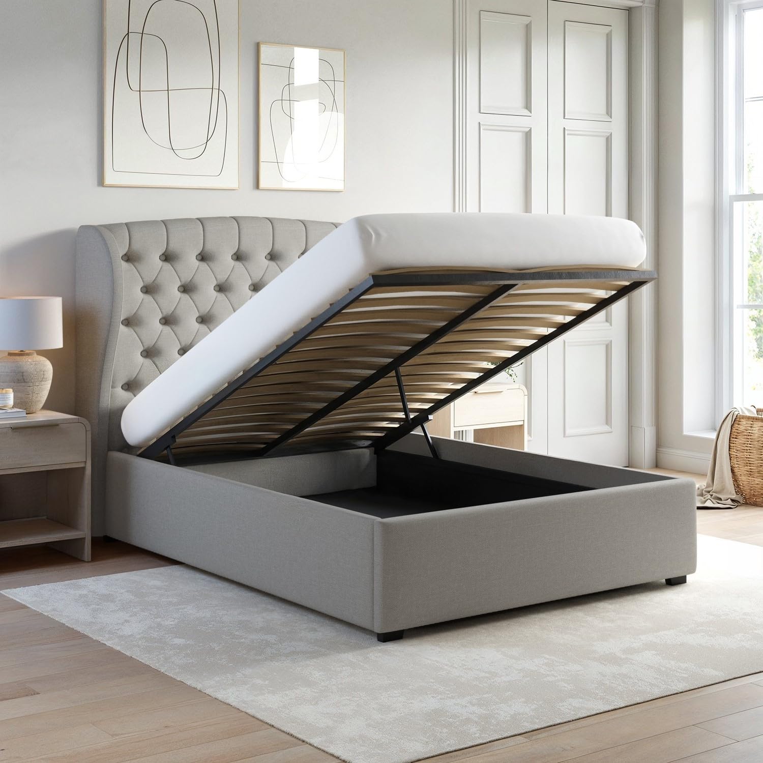 Gray upholstered bed with open storage compartment in a bedroom setting.
