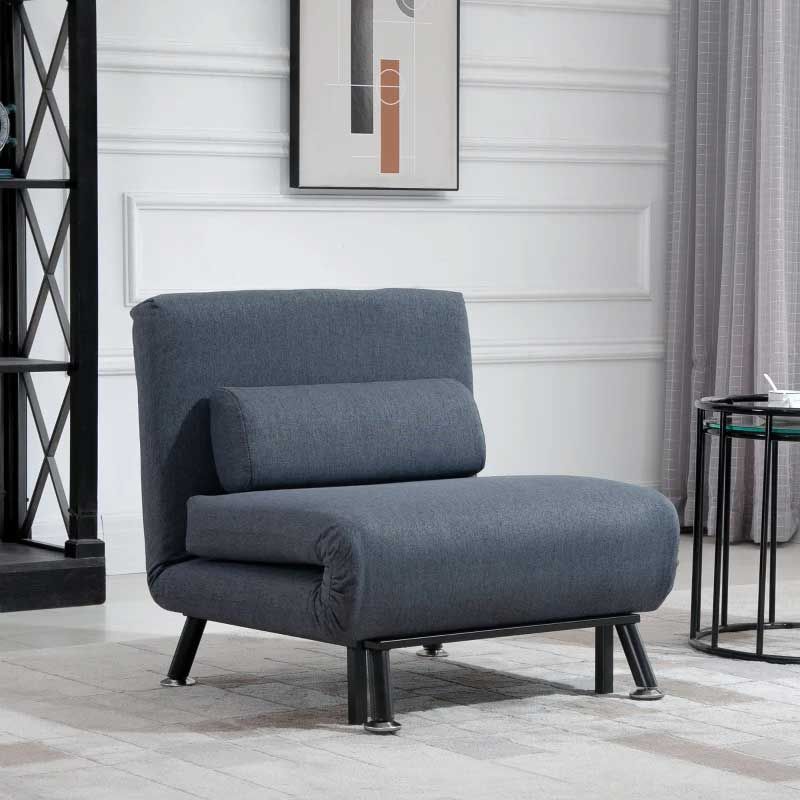 Gray armchair in a room with a white wall and decorative elements.