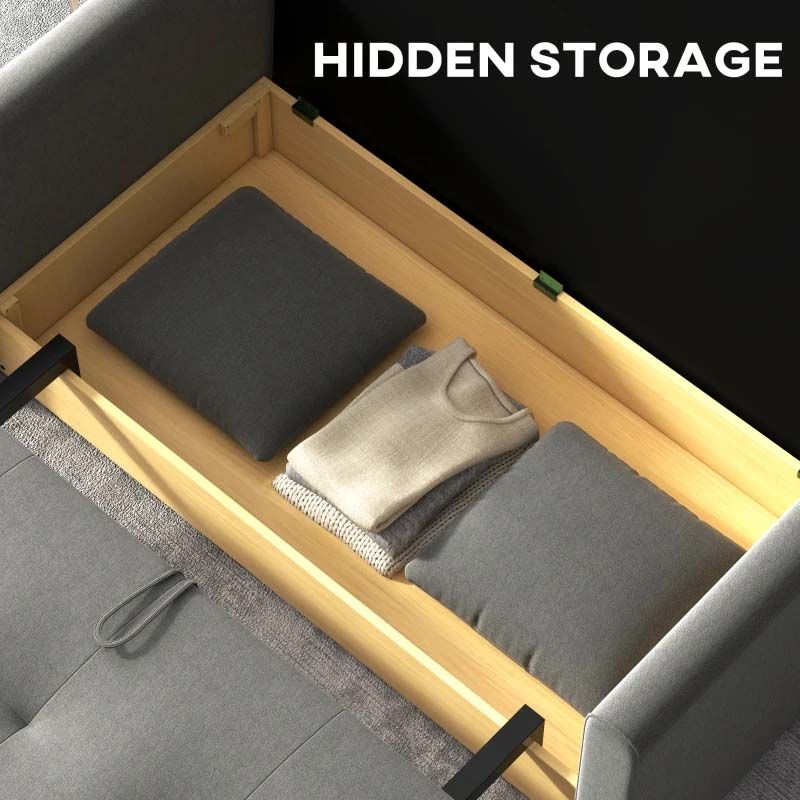 Hidden storage compartment in a sofabed with folded clothes and cushions.