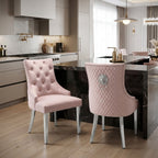 Two pink upholstered dining chairs with silver metal legs and backs