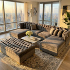 Luxurious living room with a large sectional sofa and city view.