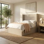 Modern bedroom with a bed, side table, and large window.