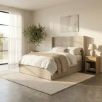 Modern bedroom with a bed, nightstands, and decor elements.