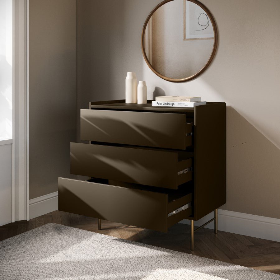 Modern dark brown dresser with open drawer in a room with a round mirror on the wall.