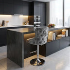 Modern kitchen with a bar counter and gray tufted bar stool.