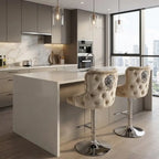 Modern kitchen with a island and bar stools, featuring gray cabinets and a large window.