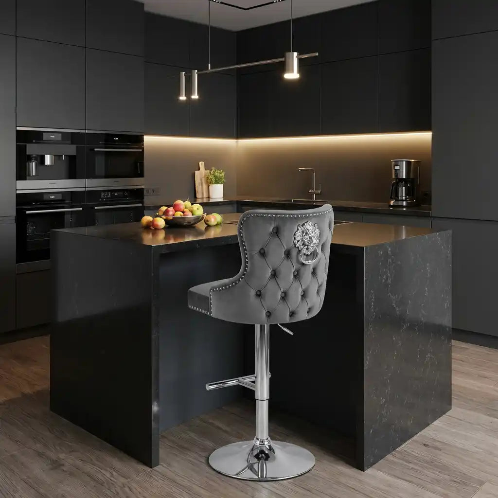 Modern kitchen with dark cabinets, a island, and a gray bar stool.