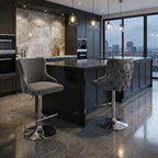 Modern kitchen with dark island, gray stools, and cityscape view