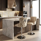 Modern kitchen with marble island and bar stools