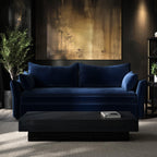 Modern living room with a blue sofabed black coffee table, and abstract painting on the wall.