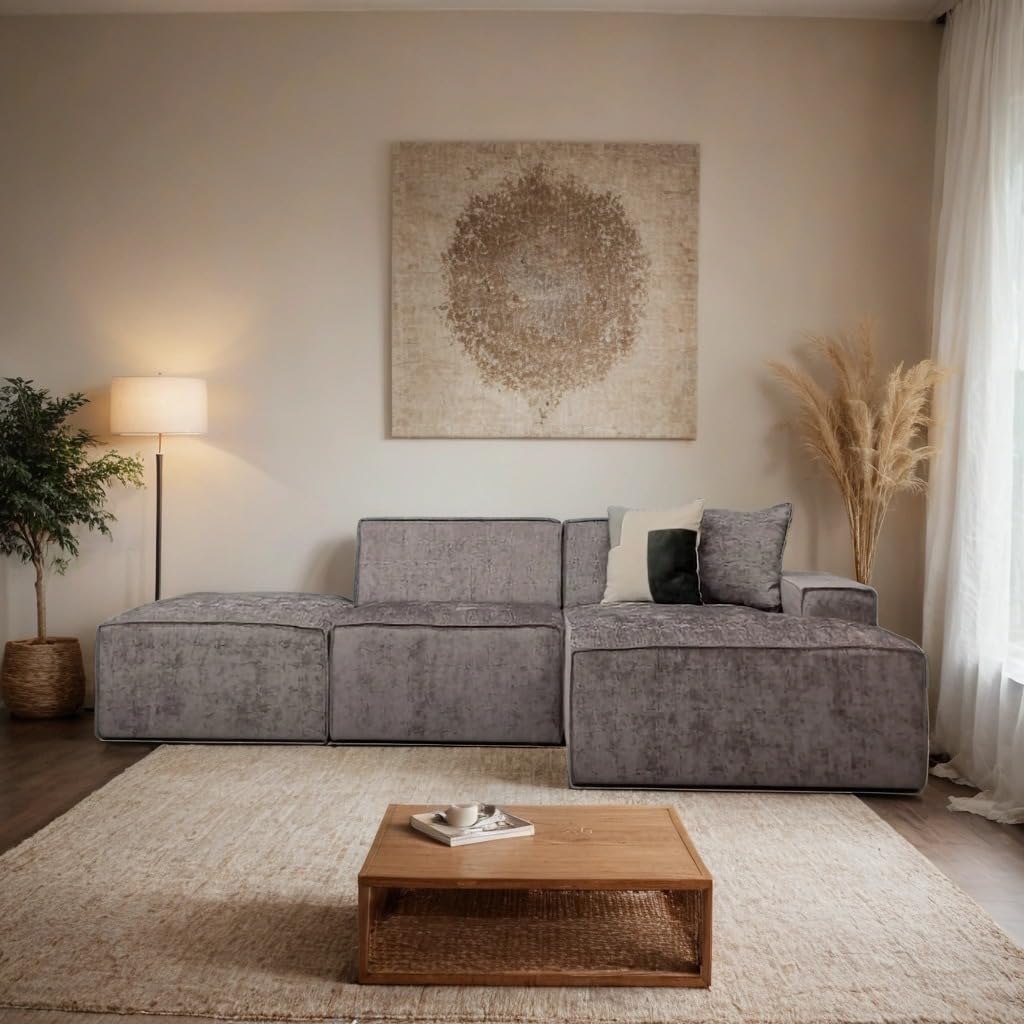 Modern living room with a gray sectional sofa, wooden coffee table, and decorative elements.
