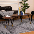 Living room with a round wooden coffee table, side table, and decorative items.