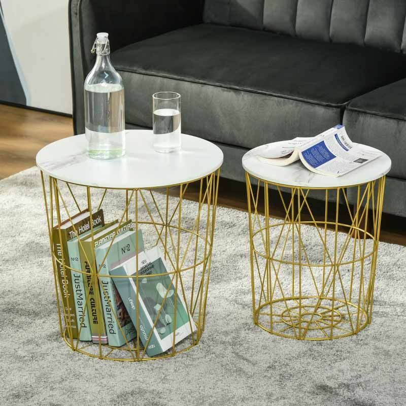 Gold wire side tables with marble tops in a living room setting.