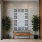 Room interior with a decorative wall piece, wooden console table, and two potted plants.