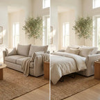 Sofa that converts into a bed in a room with a tree and window.