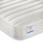 White mattress with a label on a white background