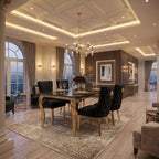 A luxury dining room featuring a rectangular black velvet dining table with gold legs, surrounded by matching black tufted chairs with gold accents, set on a large ornate patterned area rug. The room has a detailed coffered ceiling with recessed lighting, tall windows with city views, and warm wood paneling.