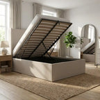 White bed frame with open storage compartment in a bedroom setting