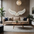 Modern living room with a beige sofa, wooden coffee table, and decorative wall art.