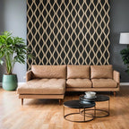 Brown leather sectional sofa in a living room with decorative wall and coffee tables.