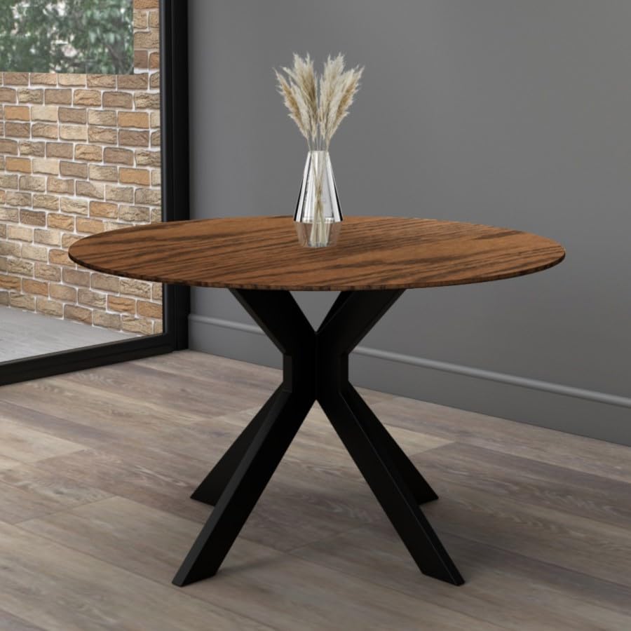 Wooden table with black metal legs against a gray wall.