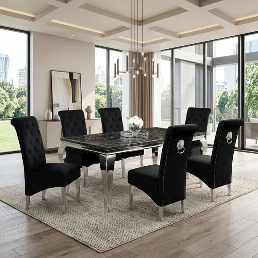A modern dining room set featuring a rectangular black marble-top table with a clear glass base and six black upholstered tufted chairs with silver legs, arranged on a textured beige rug in a bright contemporary dining room.