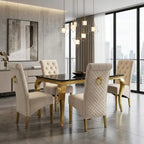 A luxury dining room set featuring a rectangular black marble-top table with gold legs, surrounded by four high-back cream tufted velvet chairs with gold legs and ring pulls, set in a modern high-rise apartment.