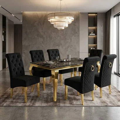 A luxury dining set featuring a rectangular table with a black marble top and gold legs, surrounded by six black tufted velvet chairs with gold legs, set in a modern dining room.