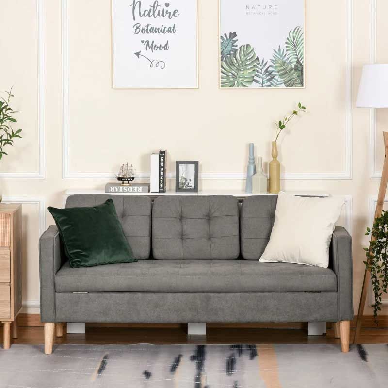 Gray sofa with decorative pillows in a living room setting