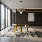 A luxury dining table with a dark marble top and ornate gold legs