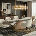 A modern dining room scene featuring a rectangular marble-top dining table with a sculptural ribbed pedestal base