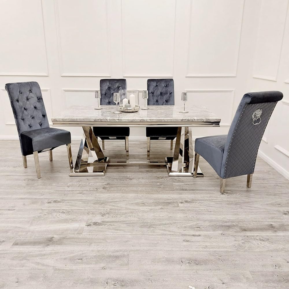 Dining table set with four gray chairs on a wooden floor.