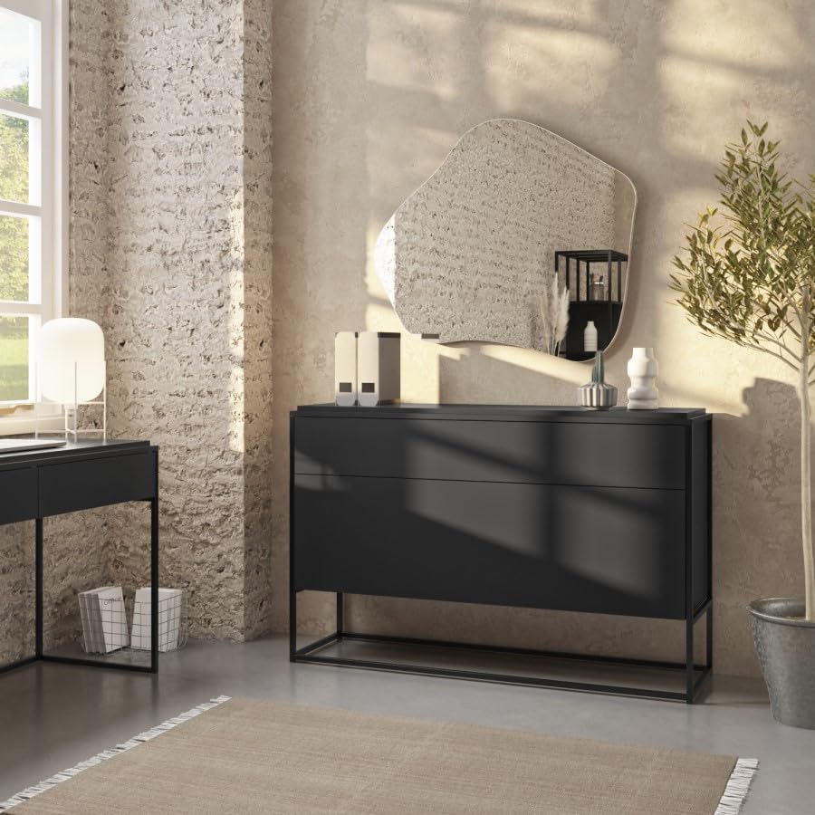 Modern black dresse with a mirror in a stylish room with brick wall and window.